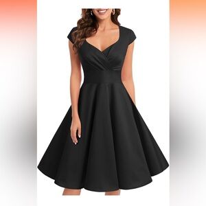 Black 50’s/60’s style dress high low worn once. Excellent condition.